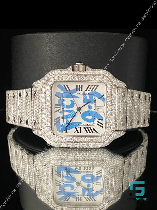 Luxury diamond-encrusted watch with a blue face on a black background
