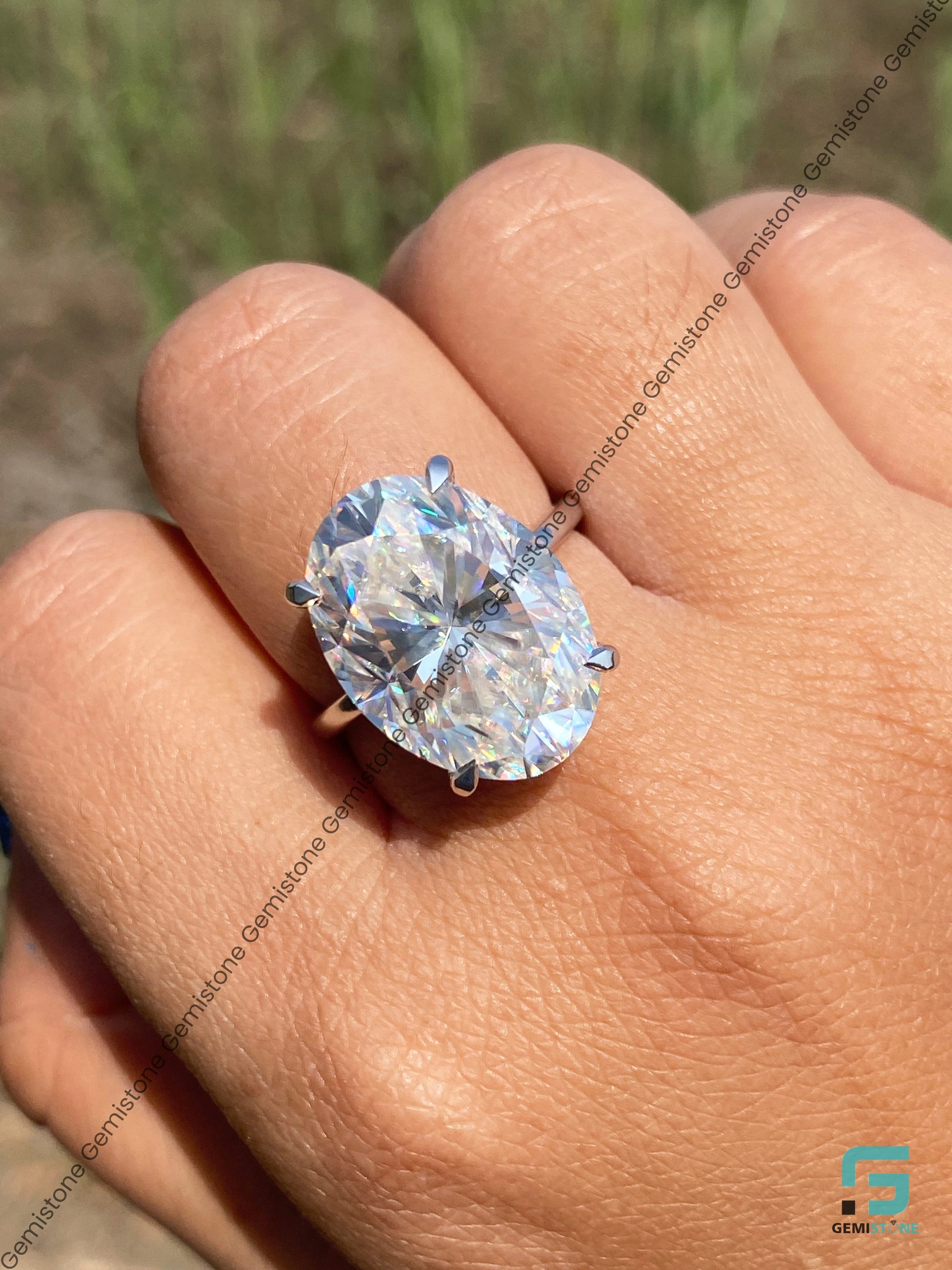 Huge Oval Hidden Halo Celebrity Ring